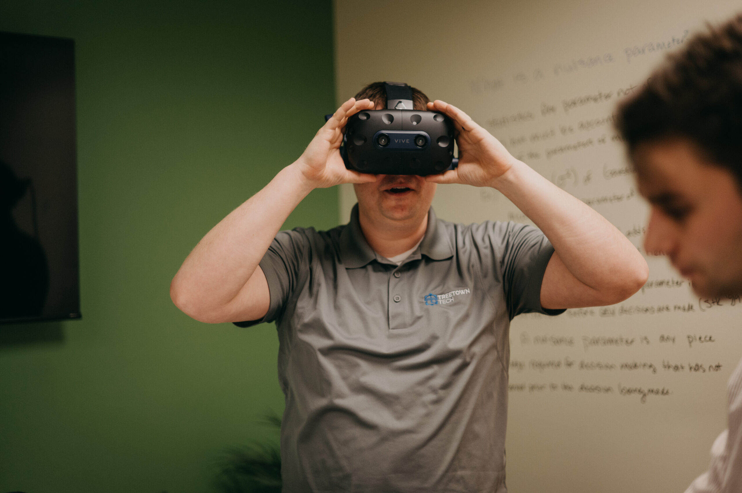 Treetown Tech employee trying a VR headset