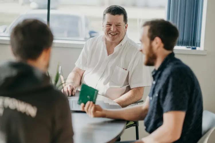 Treetown Tech employees discussing project