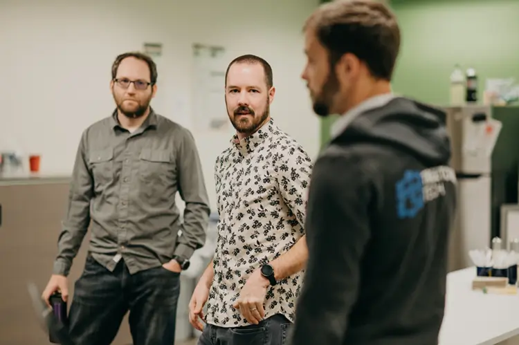 Treetown Tech employees having a conversation in the lunchroom