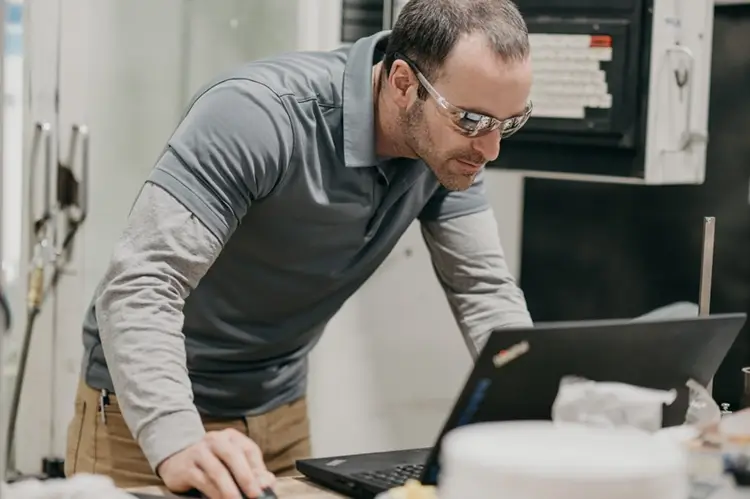 Treetown Tech employee working on a laptop