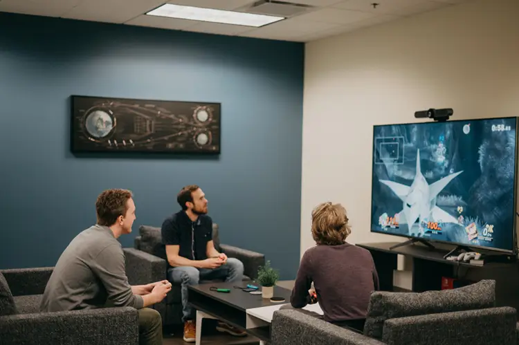 Treetown Tech employees playing a competitive game of Super Smash Bros. Ultimate