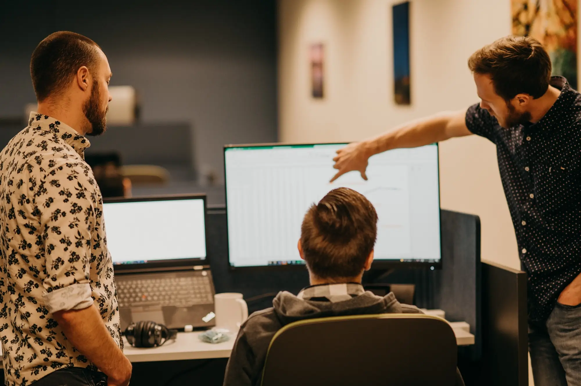 Treetown Tech employees looking at computer screen
